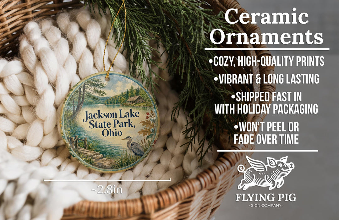 Ceramic ornaments, featuring a round ornament with a scenic image of Jackson Lake State Park, Ohio, hanging from a wicker basket.