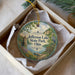 A round ornament with a scenic image of Jefferson Lake State Park, Ohio, displayed in a box.