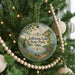 A round ornament hanging on a Christmas tree, featuring an illustration of Jefferson Lake State Park in Ohio.