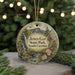 A round ornament with a scenic landscape of Jones Gap State Park, South Carolina, featuring a waterfall, pine trees, and a bridge.