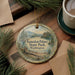 A decorative ornament with a scenic landscape of Kanaskat-Palmer State Park, Washington, featuring pine trees and a lake.