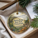 A decorative ornament with a scenic image of the Kinzua Bridge in Pennsylvania, surrounded by greenery and a note.