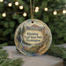 A circular ornament with a scenic mountain landscape and waterfall, featuring the text "Klickitat Trail State Park, Washington".