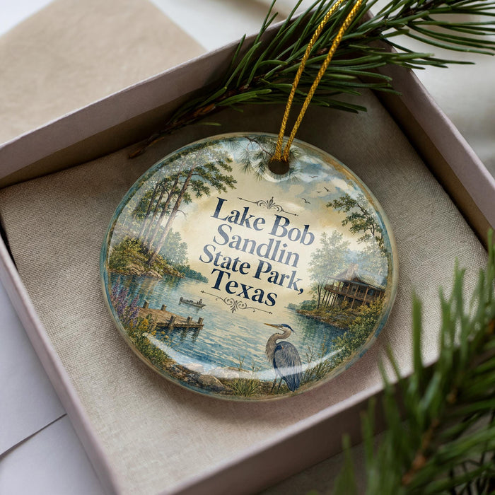 A decorative ornament in a box, featuring a scenic image of Lake Bob Sandlin State Park, Texas.