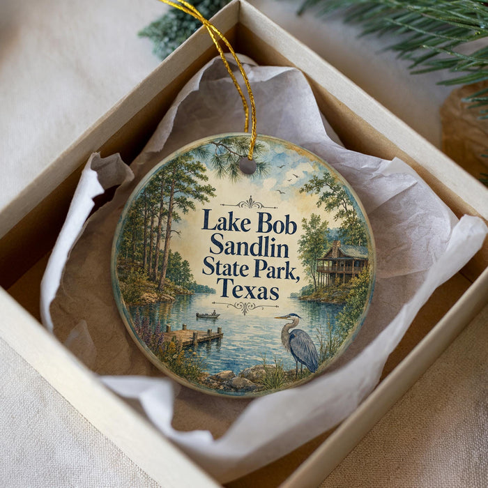 A decorative ornament in a box, featuring a scenic image of Lake Bob Sandlin State Park, Texas.