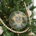 A round ornament hanging on a Christmas tree, featuring a scenic image of Lake Bob Sandlin State Park, Texas.