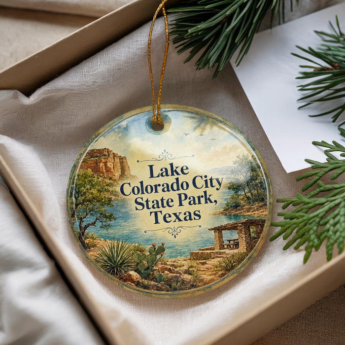 A decorative ornament with a scenic image of Lake Colorado State Park, Texas, hanging from a string.