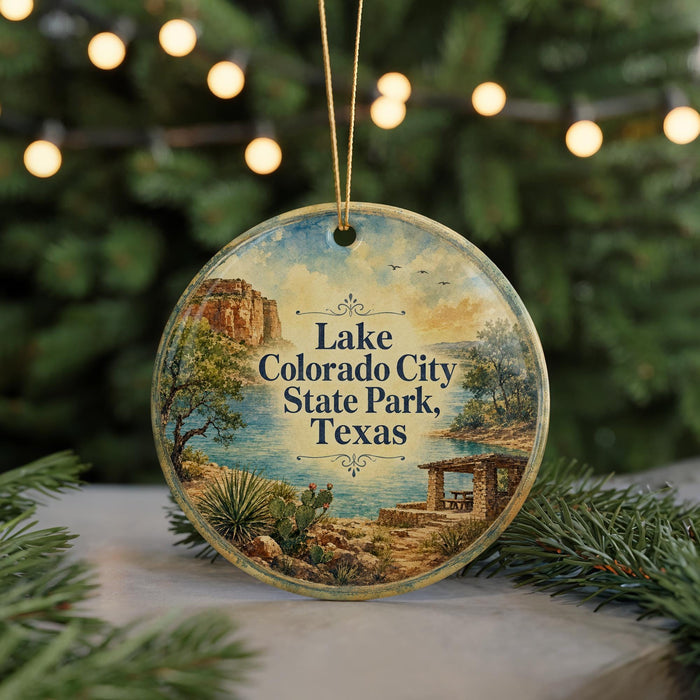A round ornament with a scenic landscape of Lake, Colorado City, State Park, and Texas, featuring a desert landscape, a cactus, and a small building.