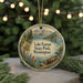 A round ornament with a scenic landscape featuring Lake Easton State Park in Washington, surrounded by pine trees and a lake.