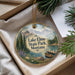 A decorative ornament with a scenic image of Lake Elmo State Park, Montana, featuring a lake, mountains, pine trees, and a boat on the water.