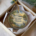A decorative ornament in a box, featuring a scenic landscape with a lighthouse, boats, and a bird, along with the text "Lake Eufaula State Park, Oklahoma".