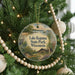 A circular ornament hanging on a Christmas tree, featuring a scenic image of Lake Kegona State Park, Wisconsin.