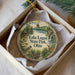 A round ornament with a scenic image of Lake Logan State Park, Ohio, featuring a bird, deer, and a waterfall.
