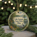 A round ornament with a scenic image of Lake Loramie State Park, Ohio, featuring a bird, a bridge, and a lake surrounded by trees.