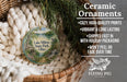 Ceramic ornaments, featuring a lake and trees, are displayed in a basket with a woven blanket.
