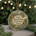 A round ornament with a scenic landscape of Lake Mineral Wells State Park, Texas, featuring a bird, a bridge, and a waterfall.