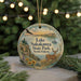 A round ornament with a scenic image of Lake Sakakawea State Park, North Dakota, featuring a deer, a bird, and a sunset landscape.