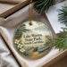 A round ornament with a scenic image of Lake Warren State Park, South Carolina, featuring a lake, trees, and a bird.
