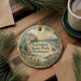 A decorative ornament featuring a scenic landscape of Larabee State Park in Washington, with pine branches and a bird in flight.
