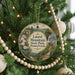 A round ornament hanging on a Christmas tree, featuring a scenic image of Laurel Mountain State Park in Pennsylvania.