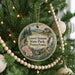 A round ornament hanging on a Christmas tree, featuring a scenic image of Laurel Summit State Park, Pennsylvania.