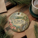A circular ornament with a scenic landscape of Lee State Park, South Carolina, featuring a lake, pine trees, and a bridge.