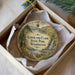 A round ornament with a scenic landscape of Lewis and Clark State Park, Washington, featuring a waterfall and a trail.
