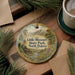 A decorative ornament featuring a scenic landscape of Little Missouri State Park, North Dakota, with a small cabin and mountains in the background.