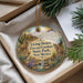 A decorative ornament with a desert landscape and wildlife scene, hanging from a string.