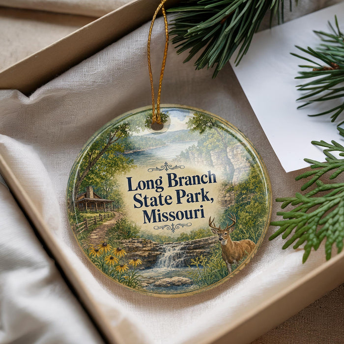 A decorative ornament with a scenic landscape of Long Branch State Park, Missouri, featuring a deer, a waterfall, and a cabin.