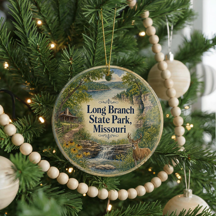 A round ornament hanging on a Christmas tree, featuring a scenic image of Long Branch State Park, Missouri.