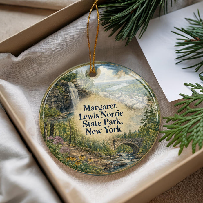 A round ornament with a scenic landscape of a waterfall, bridge, and forest, featuring the text "Margaret Lewis Norrie State Park, New York".