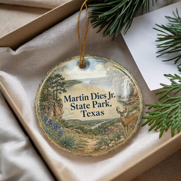 A round ornament with a scenic landscape of Martin Dies Jr. State Park, Texas, featuring a deer, pine trees, and a waterfall.