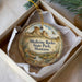 A round ornament with a scenic illustration of Medicine Rocks State Park, Montana, hanging from a string.