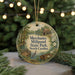 A round ornament with a scenic image of Mill Pond State Park in North Carolina, featuring a bird, a wooden cabin, and a boat on the water.