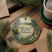 A decorative ornament featuring a scenic landscape of Millersville State Park in Washington, with pine trees, a lake, and a mountain in the background.