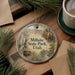 A round ornament with a scenic image of Millsite State Park, Utah, hanging on a wooden surface.