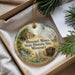 A decorative ornament with a picture of a historic site, specifically the Missouri Mines State Historic Site, displayed in a box with pine branches.