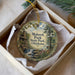 A round ornament with a scenic image of Mohawk Park, Oklahoma, displayed in a box.