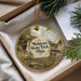 A decorative ornament with a scenic image of Mohican State Park, Ohio, hanging from a string.