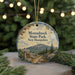 A round ornament with a scenic mountain landscape and pine trees, featuring the text "Monadnock State Park, New Hampshire" and a trail sign.