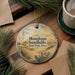 A decorative ornament with the text "Monahans Sandhills State Park, Texas" is displayed on a wooden surface, surrounded by pine branches and a cup of coffee.