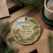 A decorative ornament with a lighthouse and a scenic landscape, featuring the text "Montauk Dows State Park, New York".