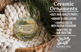 Ceramic ornaments, including a round ornament with a scenic landscape of Mormon Island, Nebraska, and a wicker basket with greenery.
