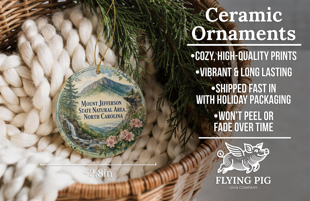 Ceramic ornaments, featuring a mountain landscape and pine trees, are displayed in a woven basket.