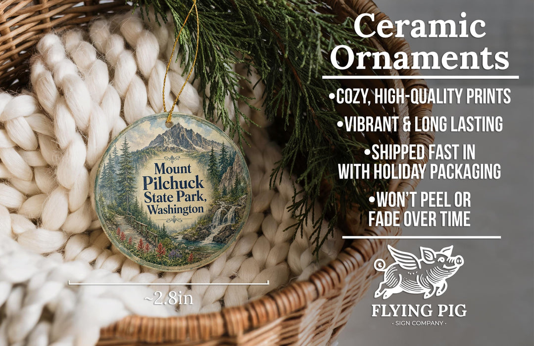 Ceramic ornaments, featuring a mountain landscape and pine trees, are displayed in a basket.