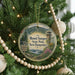 A round ornament hanging on a Christmas tree, featuring a scenic image of Mount Sunapee State Park in New Hampshire.