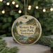 A round ornament with a scenic image of Mystery Bay State Park, Washington, hanging from a string.