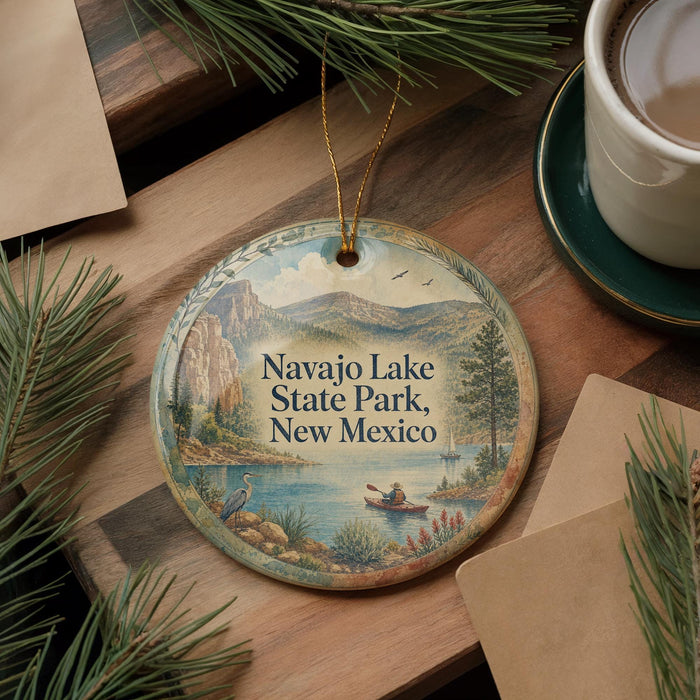 A decorative ornament featuring a scenic landscape of Navajo Lake State Park, New Mexico, with a person in a boat on the lake.