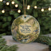 A round ornament with a scenic image of New Glarus Woods State Park, Wisconsin, featuring a winding path, a waterfall, and a bird in flight.